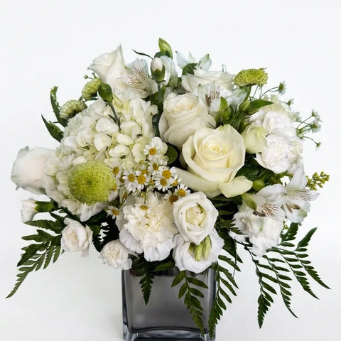 White roses, hydrangea, alstroemeria, and lisianthus in a dark cube vase — White Garden Vase by Florent Floral Newmarket
