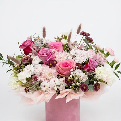 Pink roses, white chrysanthemums, and alstroemeria in a blush velvet round hat box — Pink Velvet Bloom Box by Florent Floral Newmarket