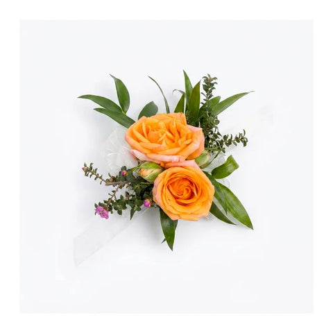 Orange-peach rose wrist corsage with white ribbon by Florent Floral in Newmarket