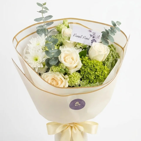 White Meadow Bouquet with white, ivory, green, and soft blue-green flowers by Florent Floral in Newmarket