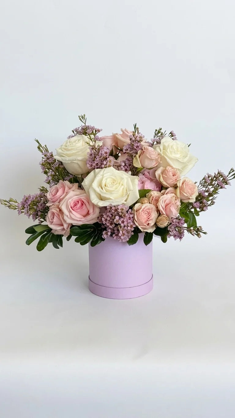 White roses, pink spray roses, and lilac in a round lilac hat box — Rose & Lilac Hat Box by Florent Floral Newmarket