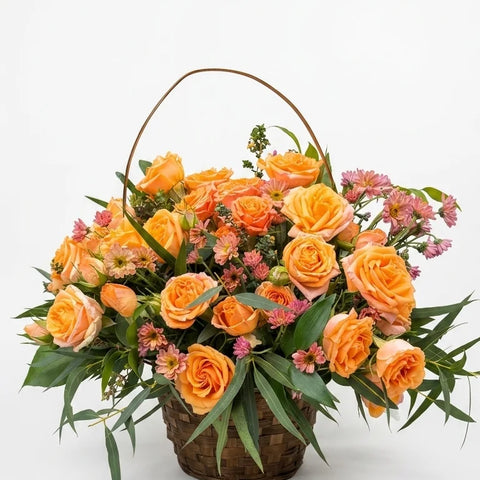 Apricot and orange rose basket arrangement by Florent Floral in Newmarket