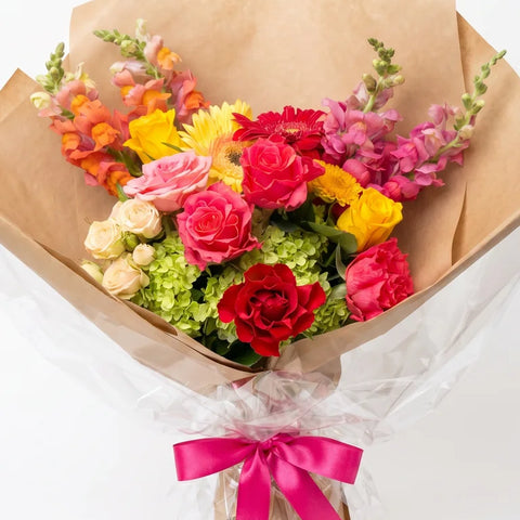 Citrus Rose Bouquet with orange, coral, hot pink, yellow, and green flowers by Florent Floral in Newmarket