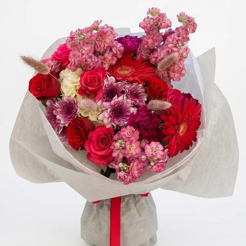 Crimson Bloom Bouquet with deep red, magenta, pink, and white flowers by Florent Floral in Newmarket