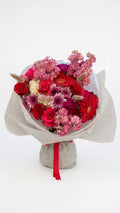 Crimson Bloom Bouquet with deep red, magenta, pink, and white flowers by Florent Floral in Newmarket