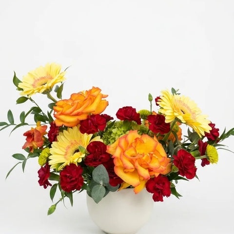 Orange rose and gerbera vase arrangement for birthday flower delivery in Newmarket Ontario
