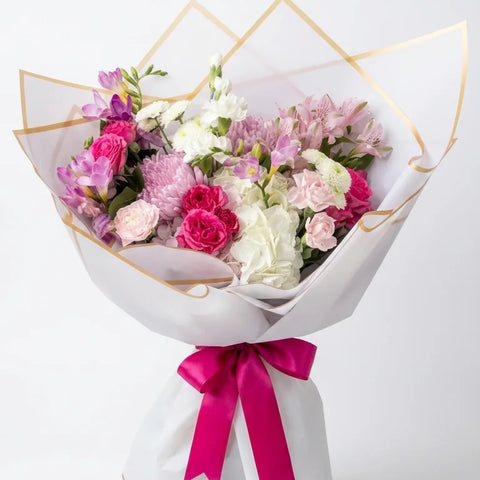 Pink rose and carnation wrapped bouquet for Mother's Day delivery in Newmarket Ontario