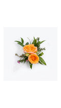 Orange-peach rose wrist corsage with white ribbon by Florent Floral in Newmarket