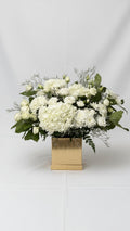 White flower arrangement for sympathy and funeral delivery in Newmarket Ontario