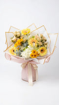 Yellow gerbera wrapped bouquet for birthday flower delivery in Newmarket Ontario